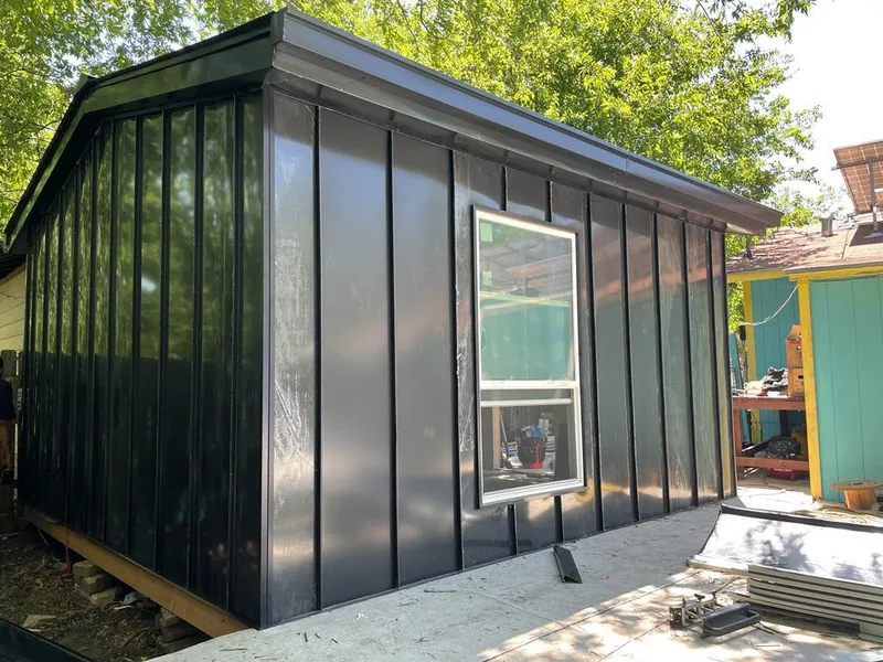 Black standing seam metal wall panels for Metal Roof Installation in North Manchester